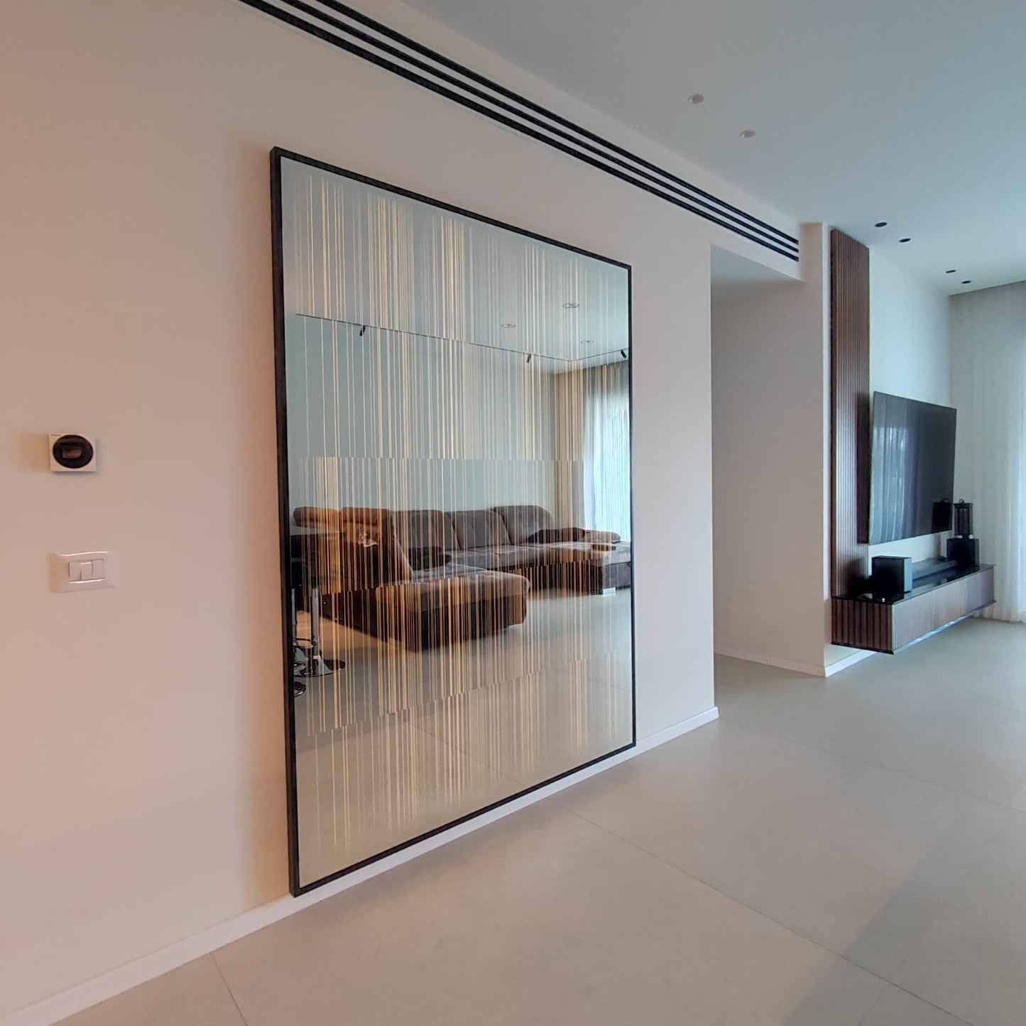 Illuminated mirror for the living room
