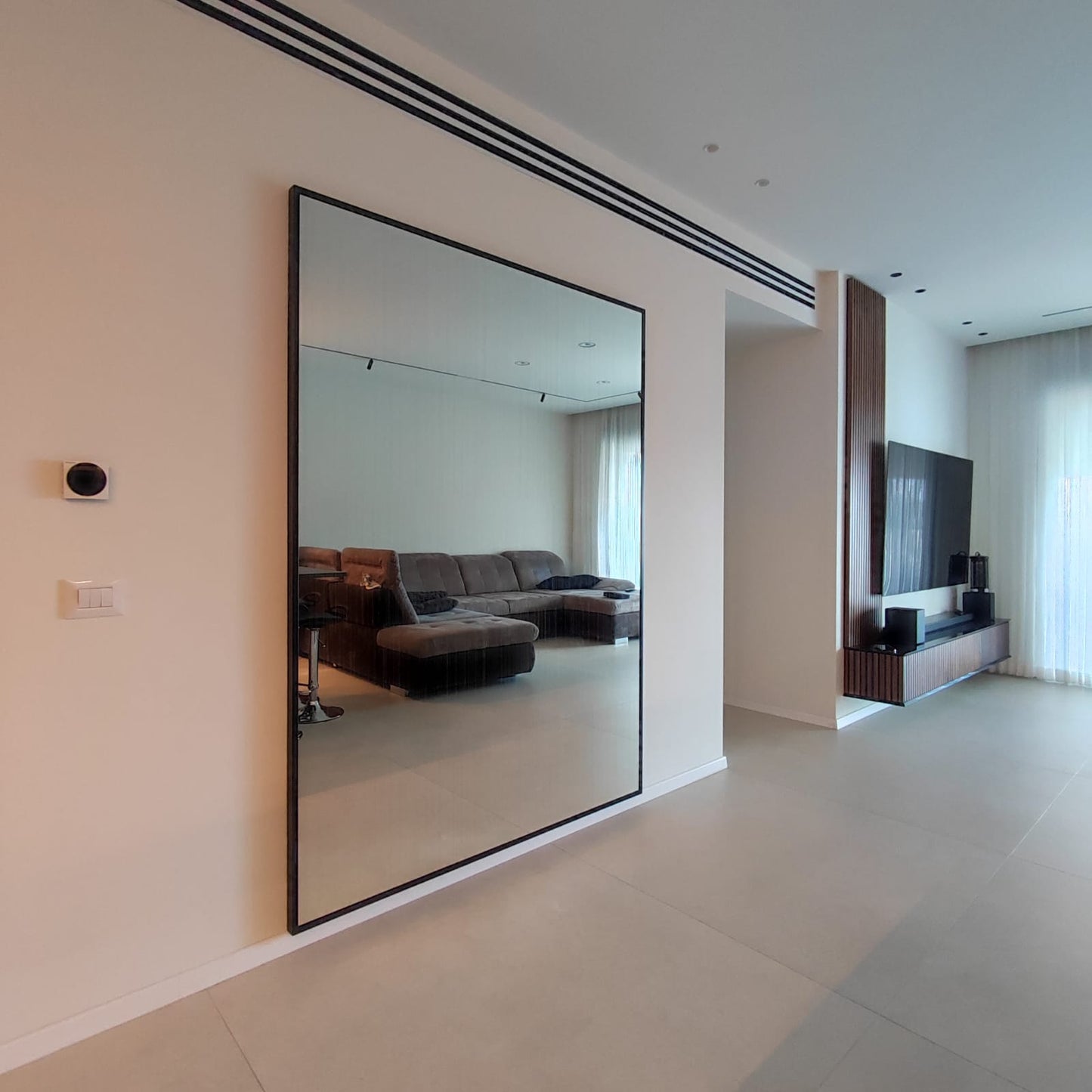Illuminated mirror for the living room