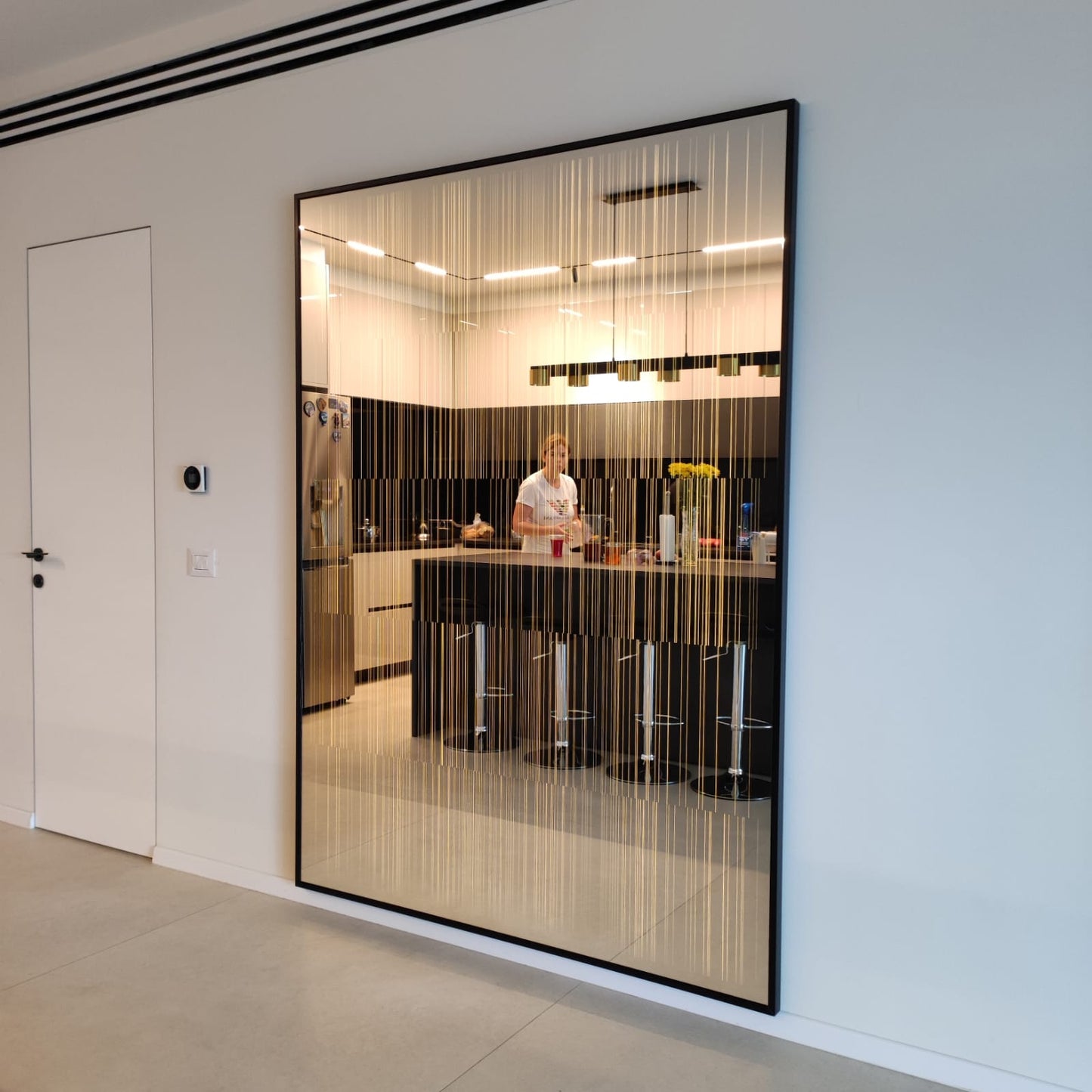Illuminated mirror for the living room